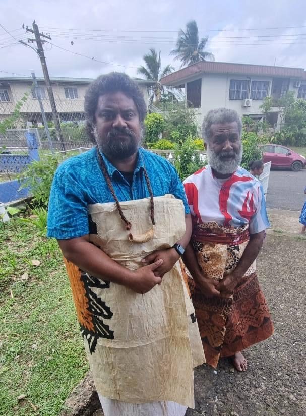 two men dressed to show that they observed the mourning period for a loved one.